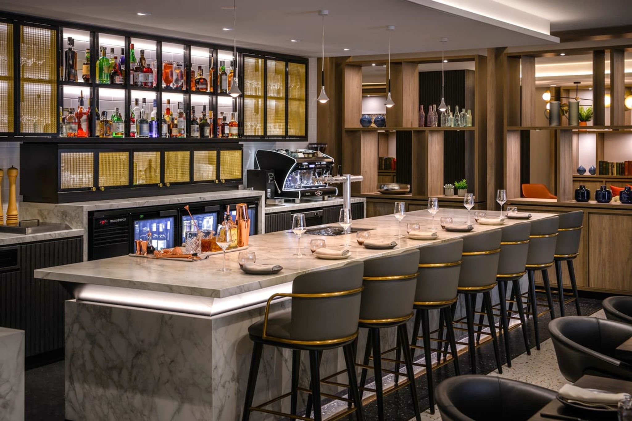 Bar with marble counter and stools at Mövenpick Hotel Hobart