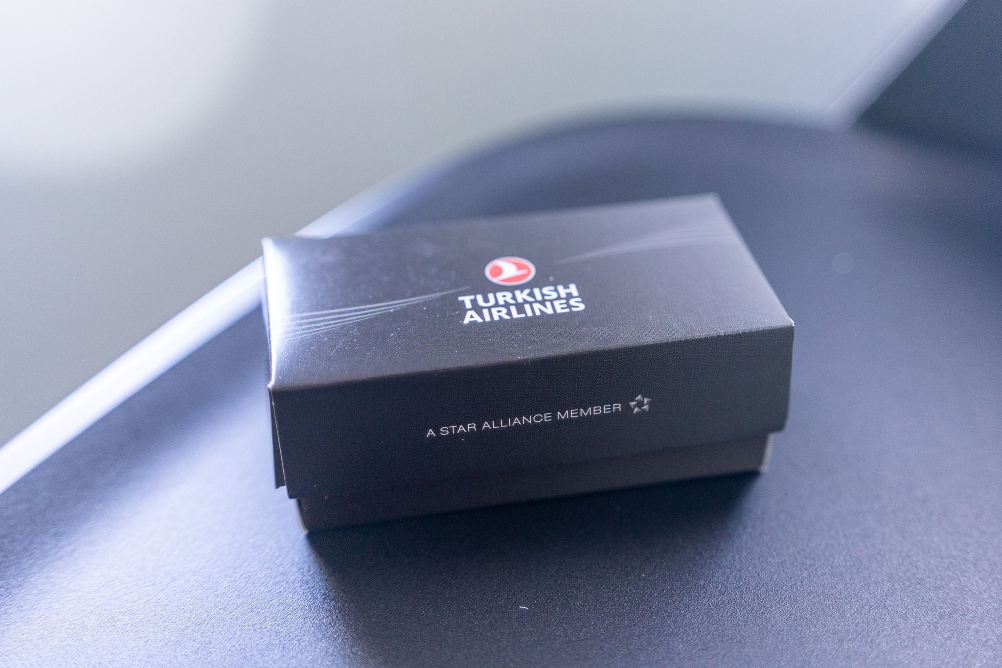Turkish Airlines branded gift box on a seat console