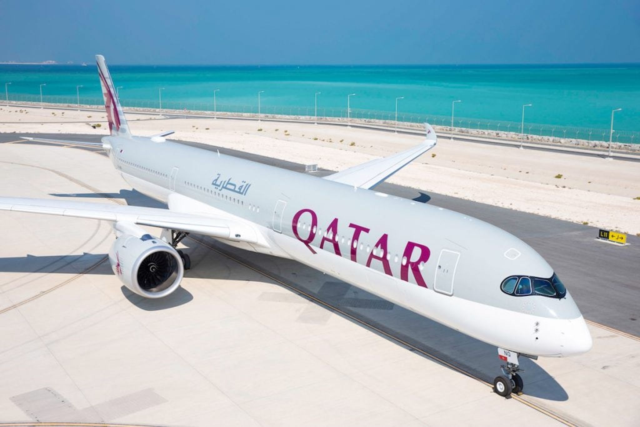 Qatar Airways Airbus A350 parked beside the sea