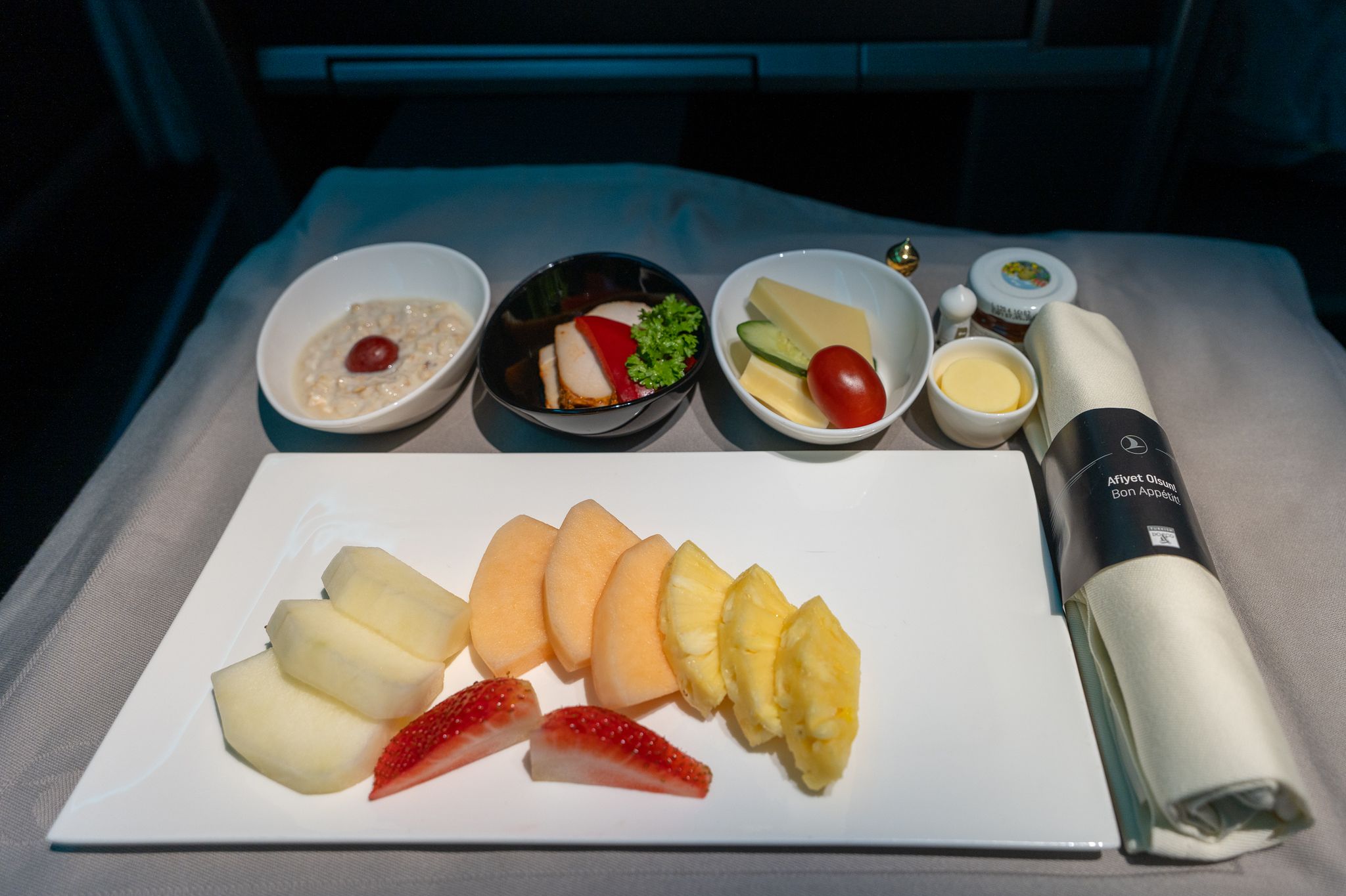 Turkish Airlines business class breakfast with fresh fruit, cheese and muesli