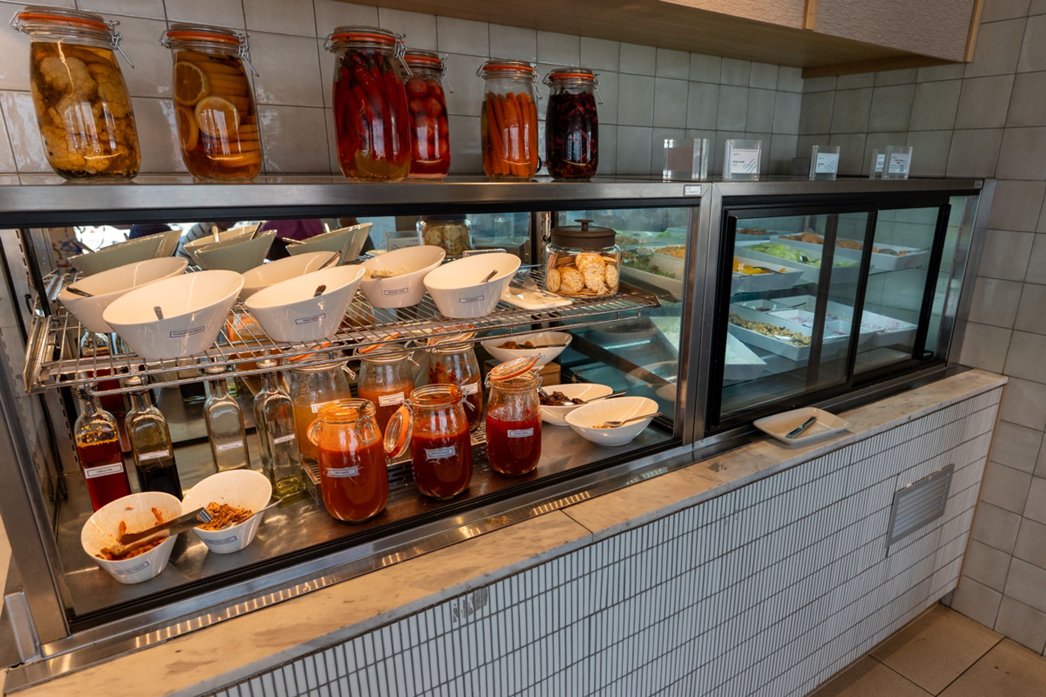 Food and condiment jars on display in the SkyTeam Lounge Sydney