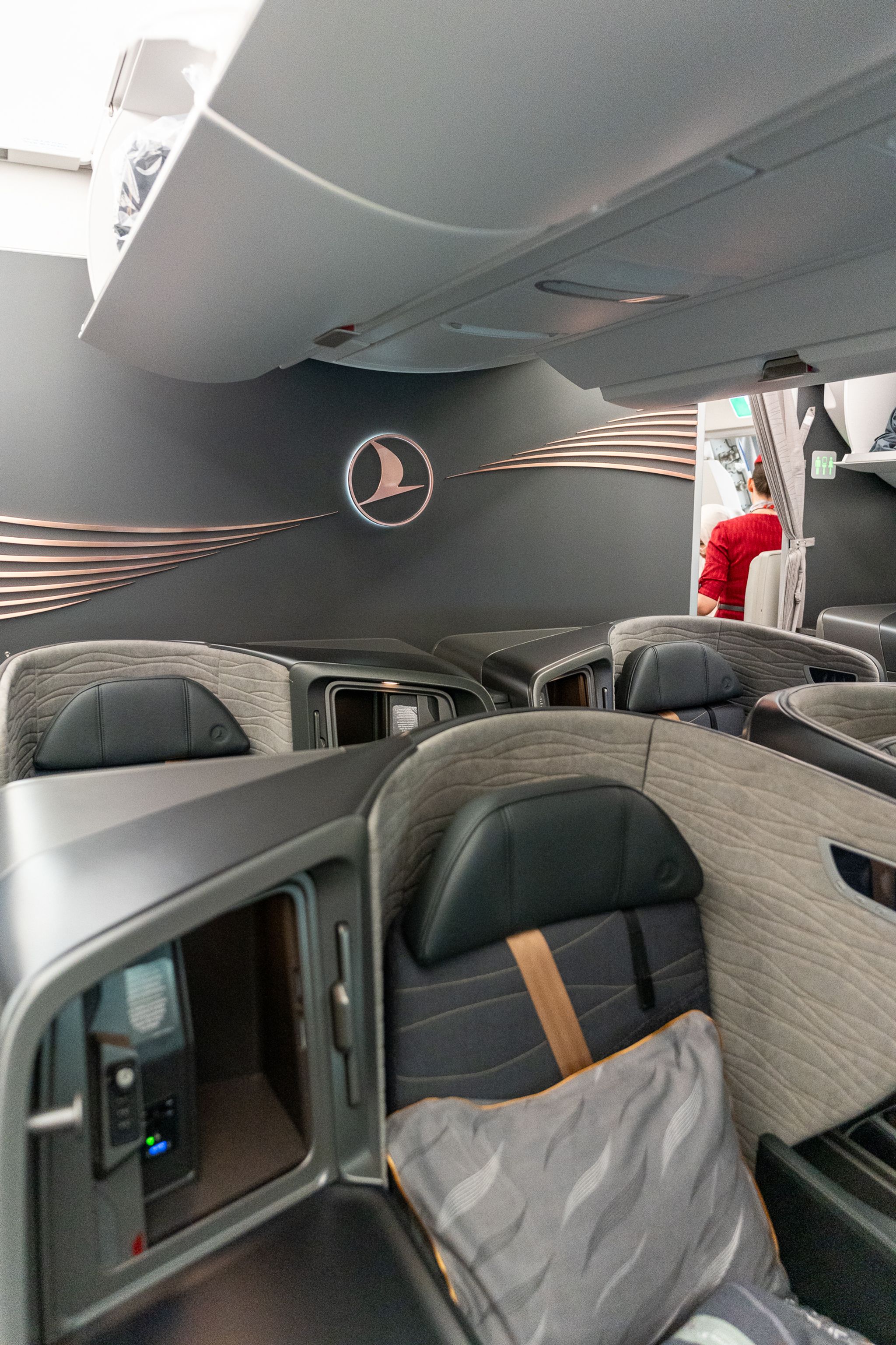 Turkish Airlines A350 business class cabin with the airline logo on the bulkhead
