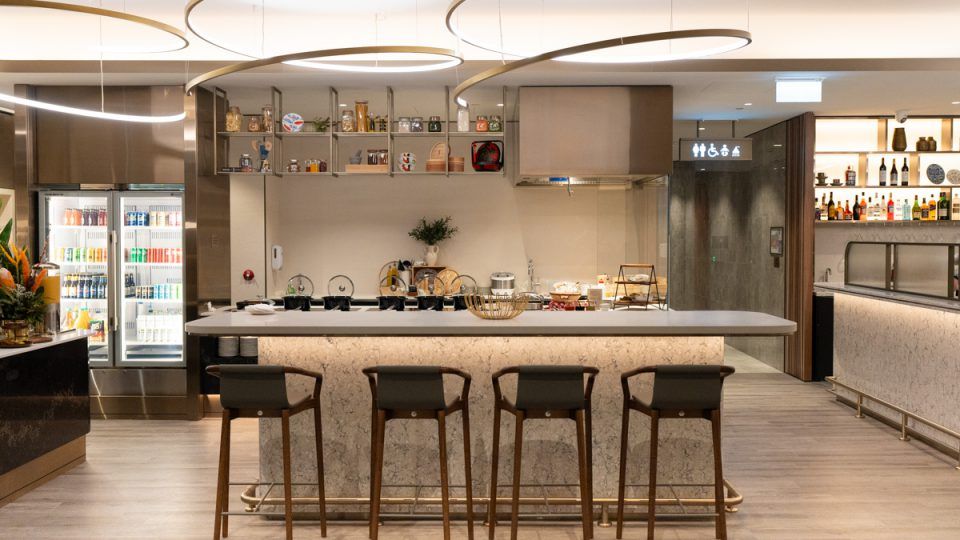 Bar and buffet counter with stools at the Singapore Airlines SilverKris Lounge in Perth
