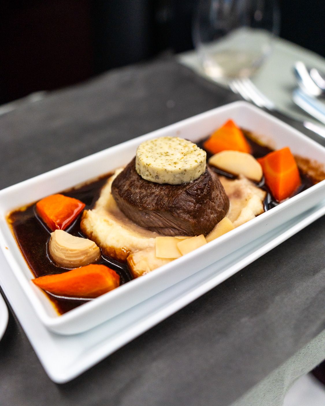 Steak with potato purée and red wine sauce in Japan Airlines business class