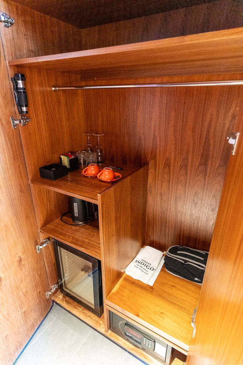 Hotel Indigo Sydney wardrobe with coffee cups, kettle, mini fridge and safe