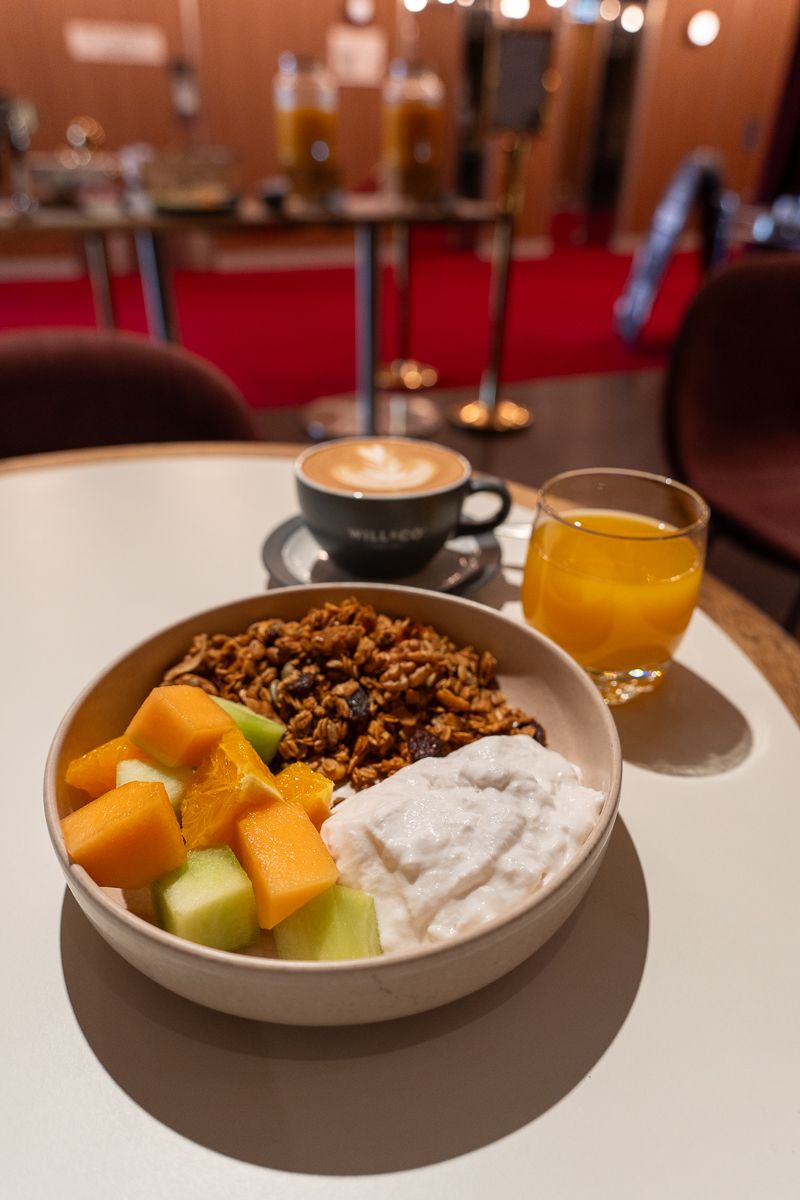 Toasted granola with fruit and yoghurt, coffee and juice at The X, Hotel Indigo Sydney