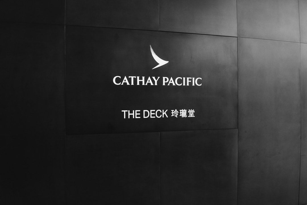 Cathay Pacific The Deck lounge sign on a dark wall