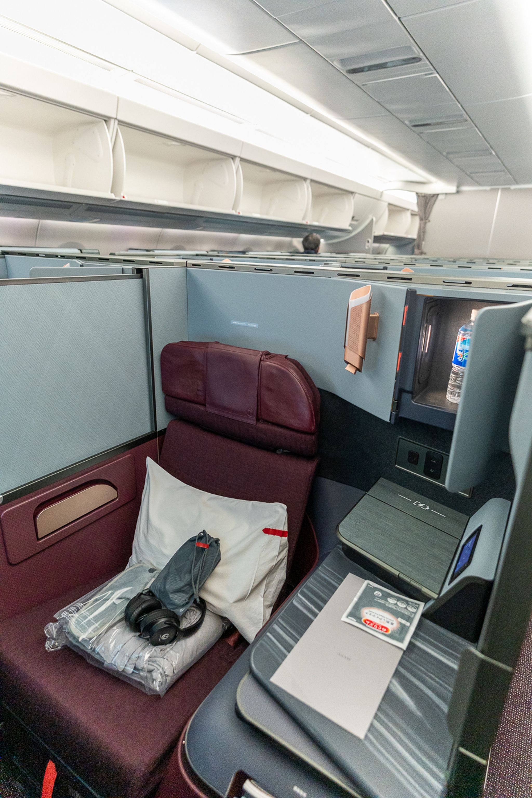 Japan Airlines A350-1000 business class seat with red fabric and pillow