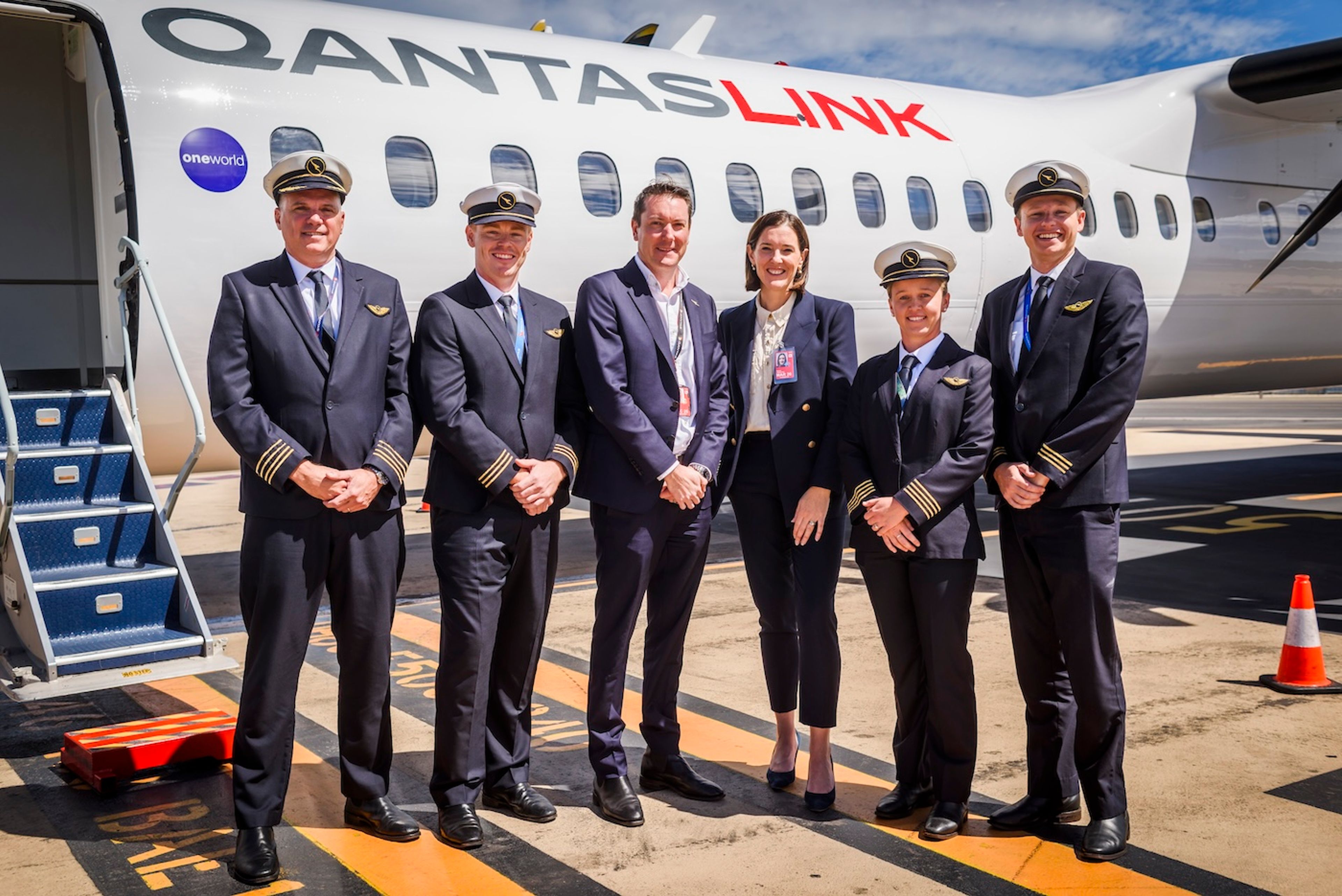 Qantas crew and QantasLink CEO Rachel Yangoyan with Dash 8