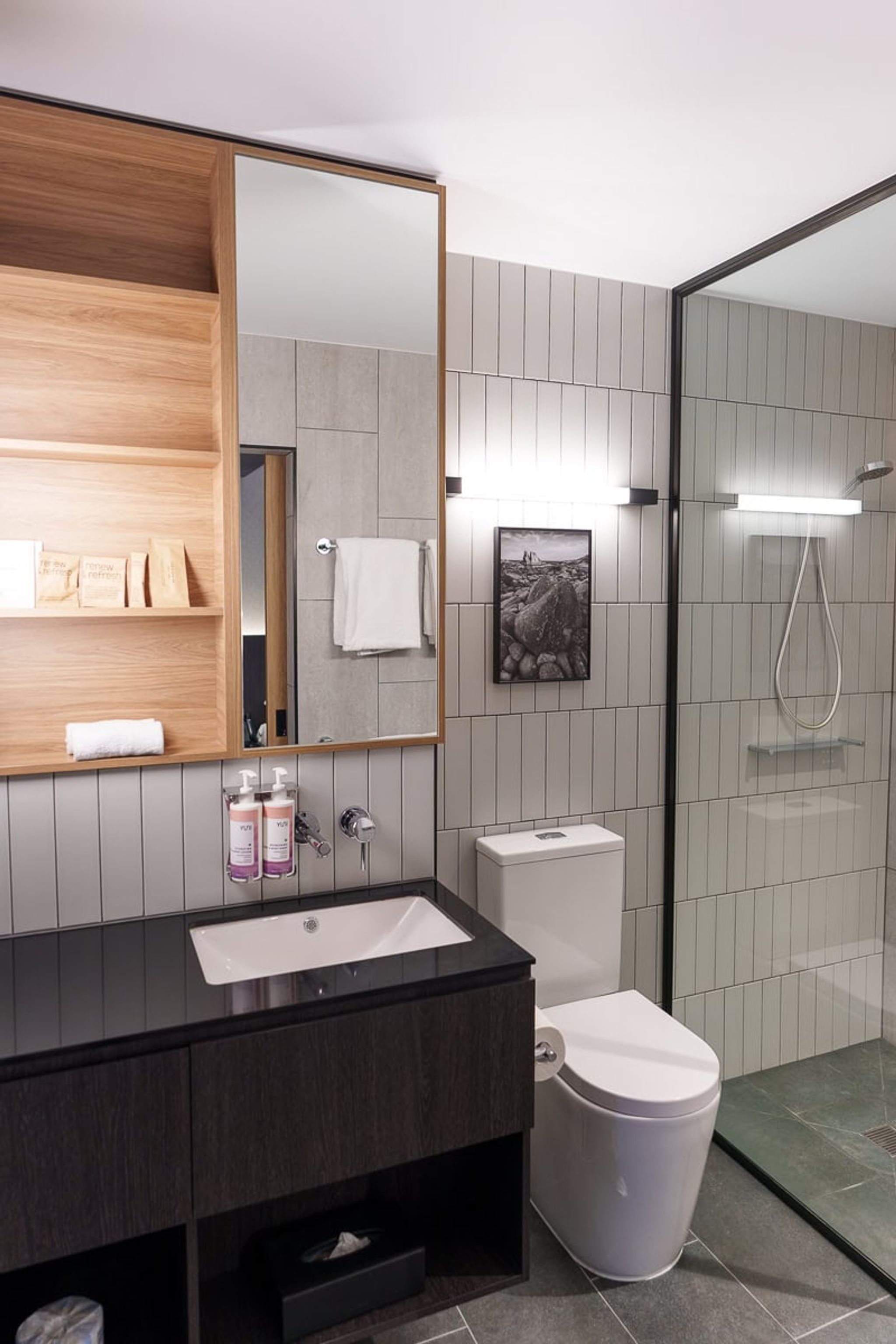 Compact bathroom with rain shower at Mövenpick Hotel Hobart