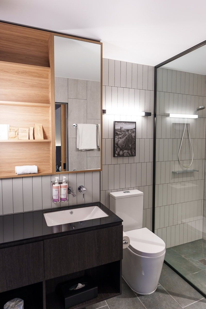 Compact bathroom with rain shower at Mövenpick Hotel Hobart