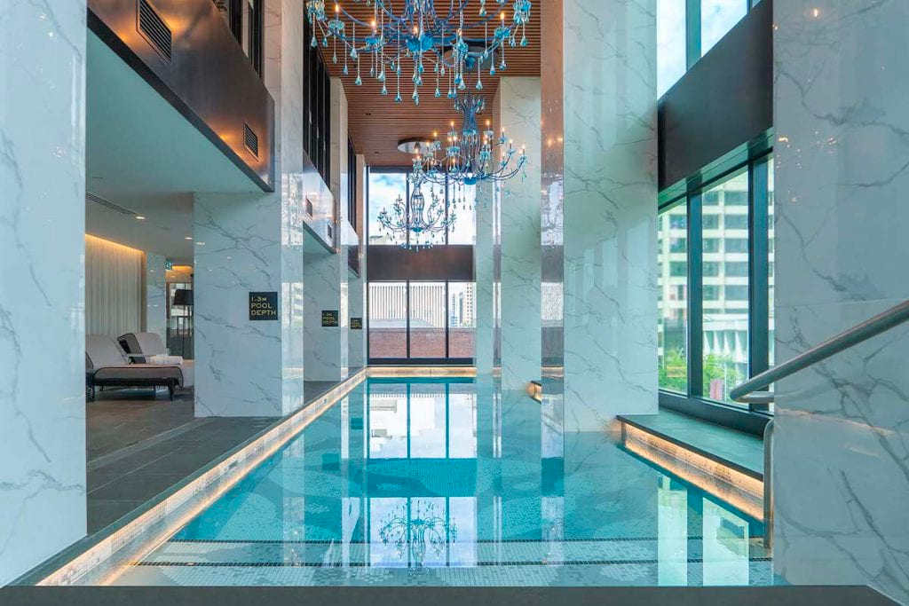 Indoor pool with chandeliers at Sofitel Adelaide