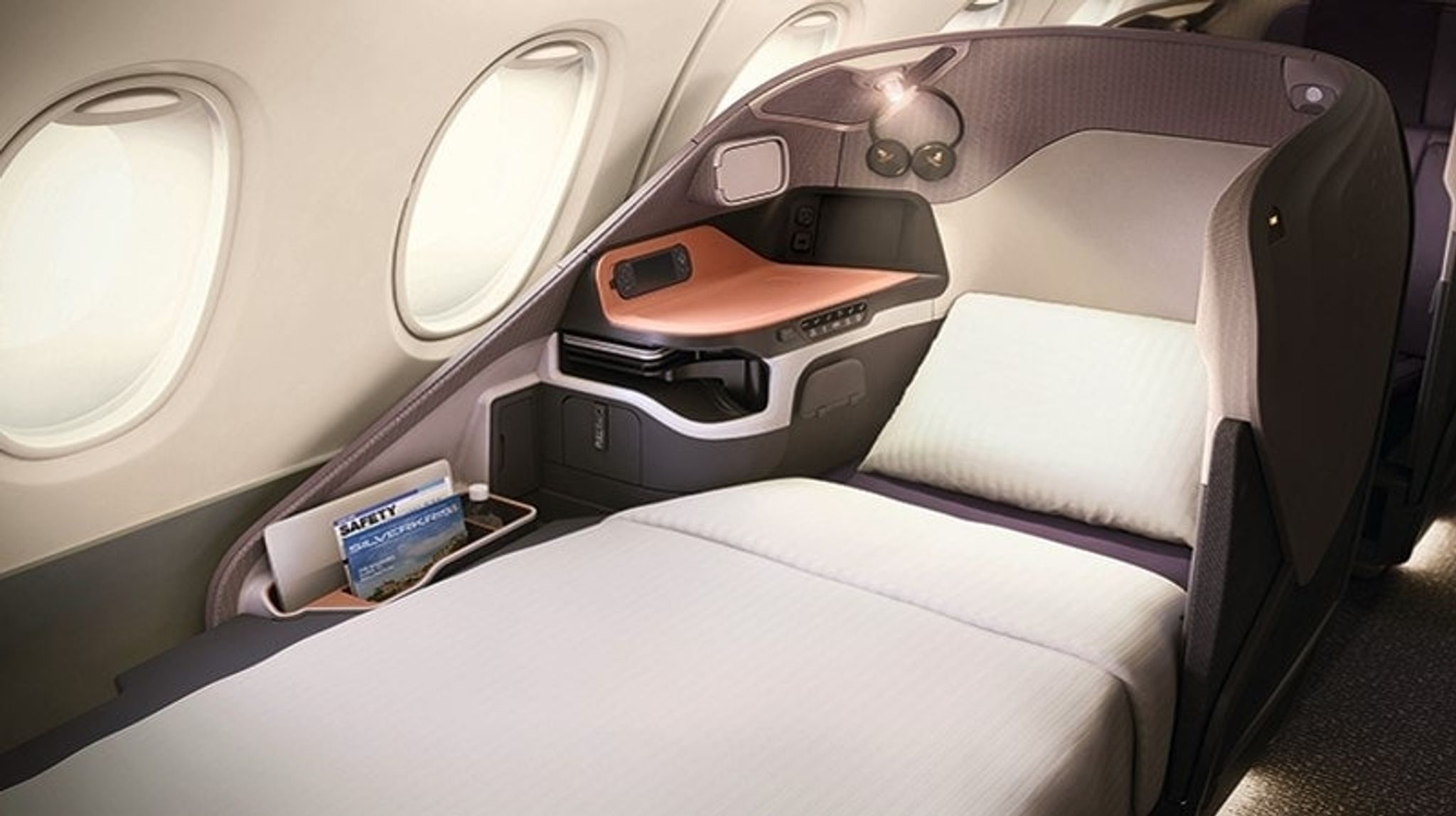 Singapore Airlines business class seat made up as a bed