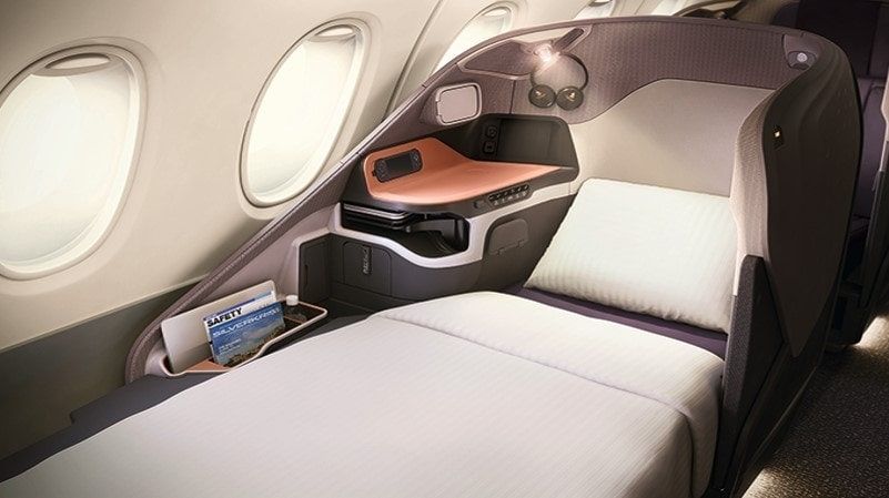 Singapore Airlines business class seat made up as a bed