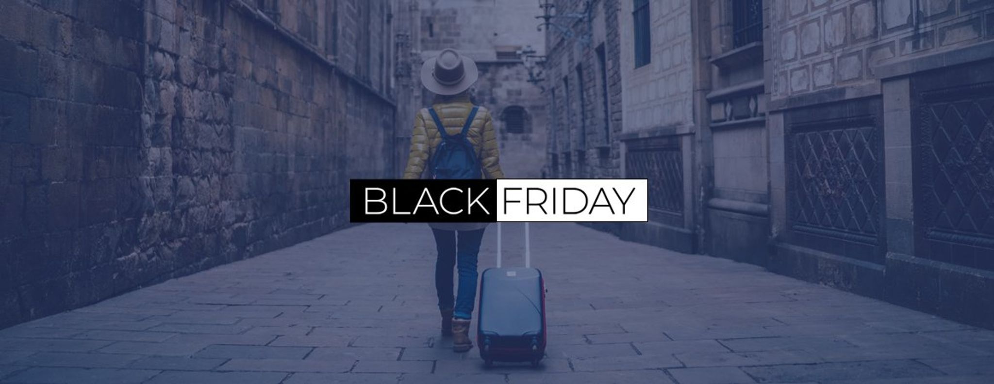 Black Friday banner with a traveller wheeling a suitcase down a laneway