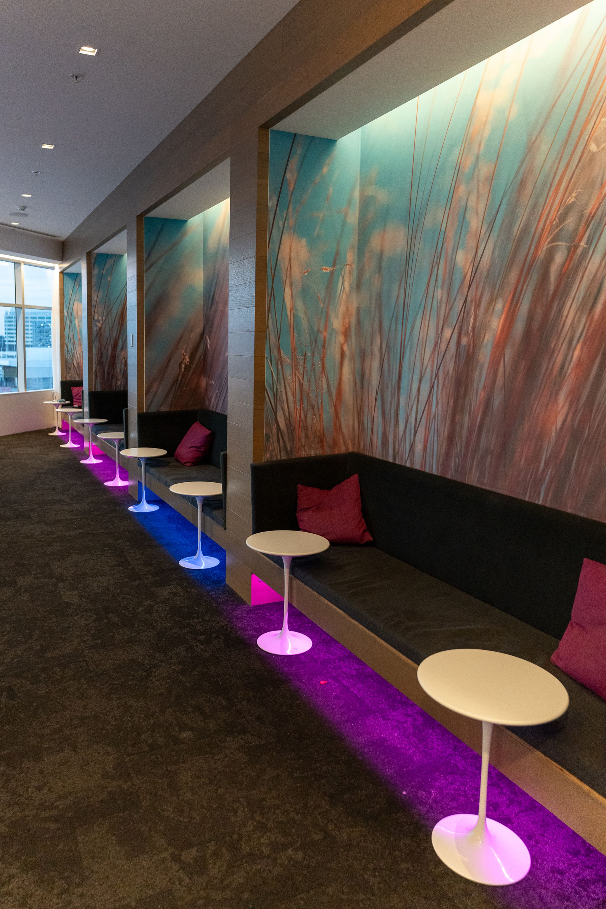 Banquette seating with a grass mural in the Air New Zealand Lounge, Sydney