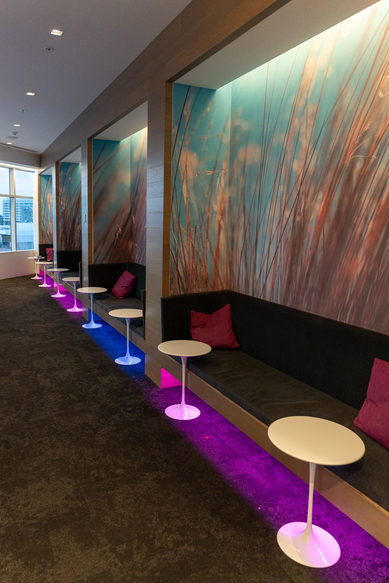Banquette seating with a grass mural in the Air New Zealand Lounge, Sydney