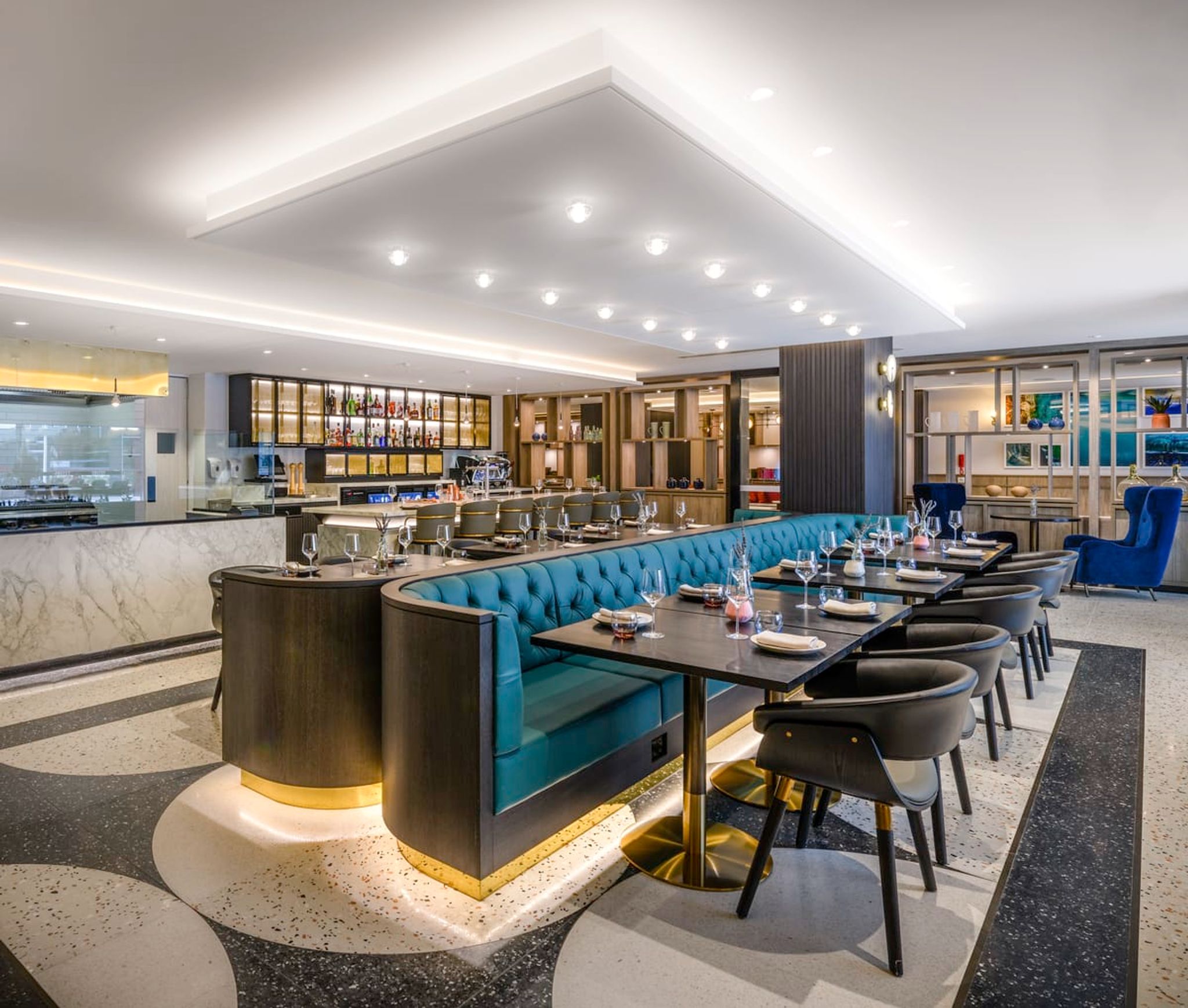 Restaurant at Mövenpick Hobart with teal banquettes and a bar