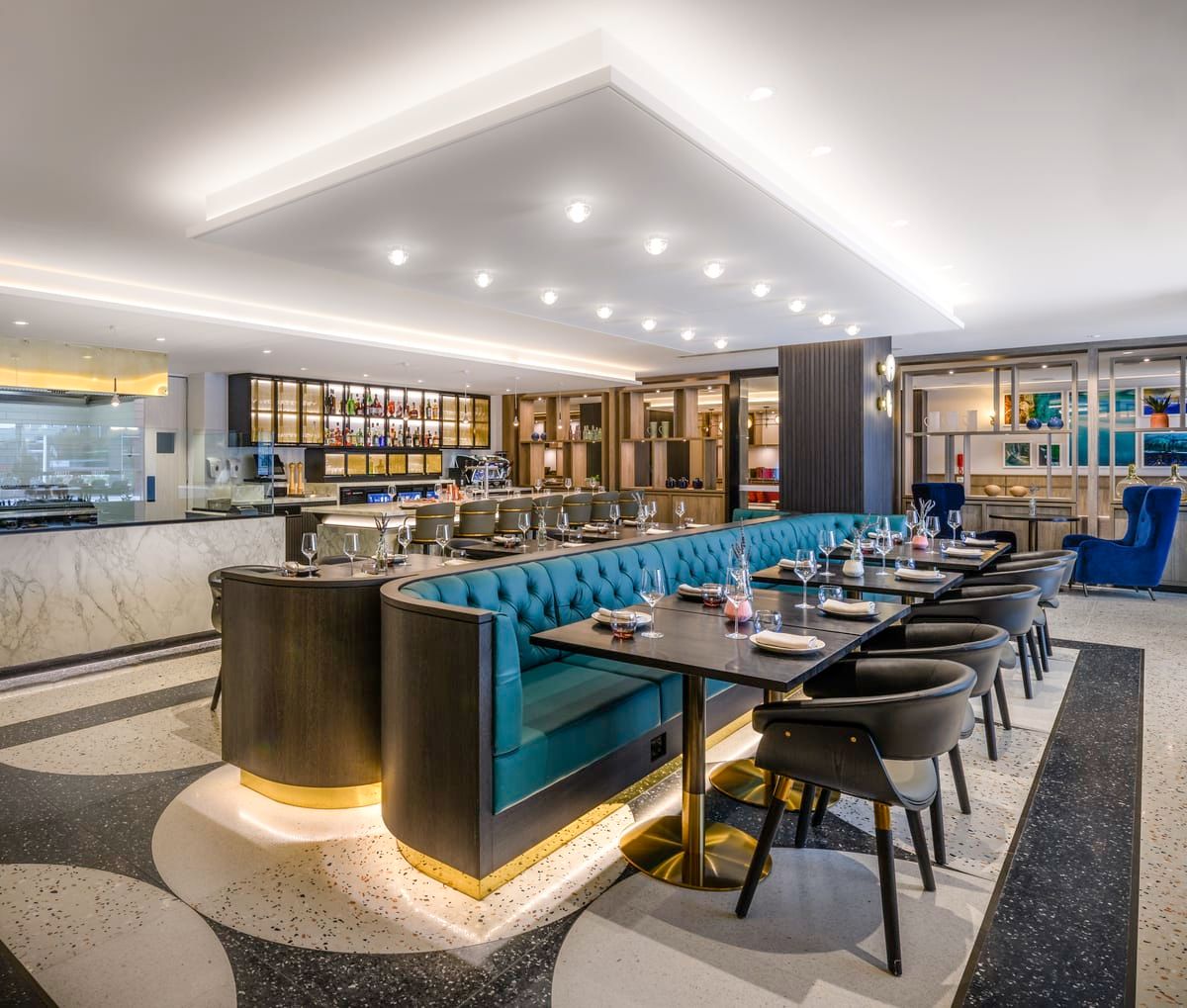 Restaurant at Mövenpick Hobart with teal banquettes and a bar
