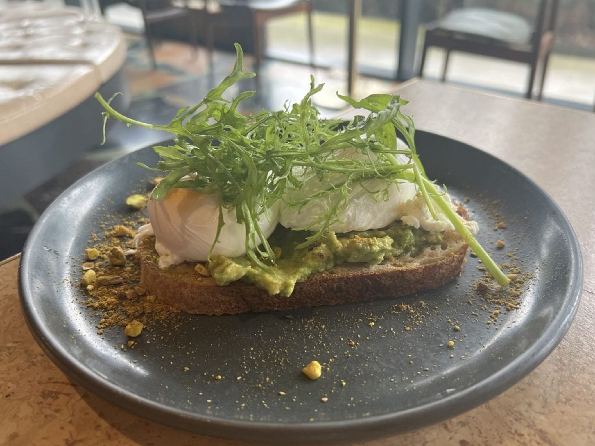 Smashed avocado with poached eggs on sourdough at Monster Kitchen and Bar, Canberra