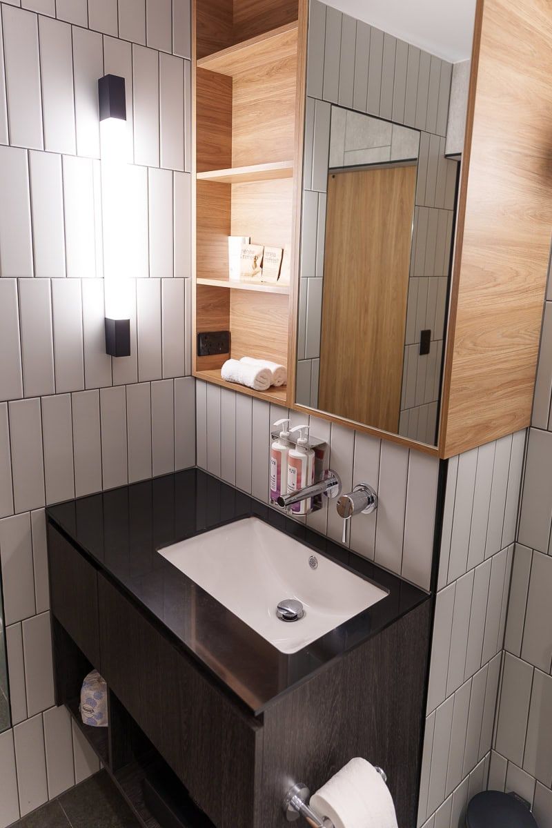 Bathroom vanity with mirror cabinet in a Mövenpick Hobart room